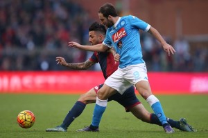 Genoa's defender Armando Izzo (L) fights for the ball with Napoli's forward Gonzalo Higuain from Argentina during the Italian Serie A  football match Genoa Vs Napoli on November 1, 2015 at the Luigi Ferraris Stadium in Genoa.  AFP PHOTO / MARCO BERTORELLO        (Photo credit should read MARCO BERTORELLO/AFP/Getty Images)
