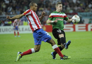 Athletic Bilbao's forward Iker Muniain (R) vies with Atletico Madrid's Brazilian defender Joa Miranda de Souza during the UEFA Europa League final football match between Club Atletico Madrid and Athletic Club Bilbao on May 9, 2012 at the National Arena stadium in Bucharest. AFP PHOTO / ANNE-CHRISTINE POUJOULAT        (Photo credit should read ANNE-CHRISTINE POUJOULAT/AFP/GettyImages)